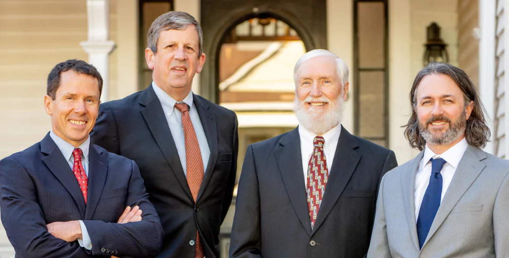 Posing outside one of their Athens, Georgia, offices, situated in a former house, are Social Security Disability lawyers Patrick Cates, Michael Keene, Kent Silver and Ben Walters.